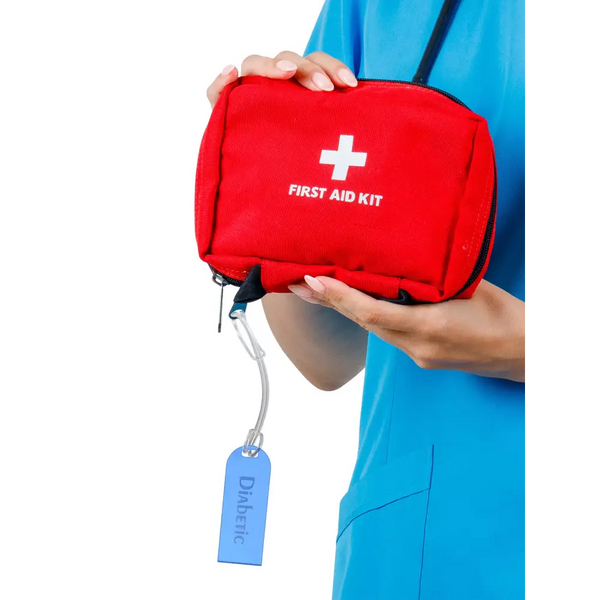 Diabetic luggage tag attached to a red first aid kit, showcasing clear identification for travelers with diabetes.