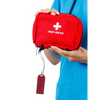 Diabetic luggage tag attached to red first aid kit, highlighting diabetes medical supplies.