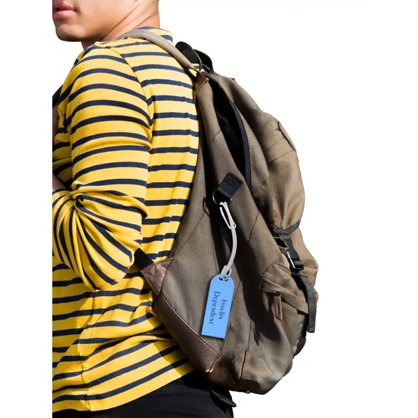 Diabetic luggage tag attached to backpack for easy identification.
