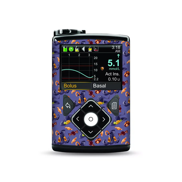 Medtronic MiniMed Insulin Pump with Halloween Edition Stickers featuring pumpkins and bats.