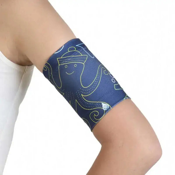 Glucose sensor armband for kids with sea-themed design.
