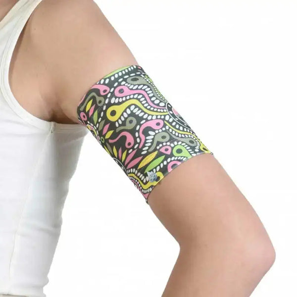 Blood glucose sensor armband for children with trendy prints, featuring a colorful and comfortable design, securely holds sensors for active kids.