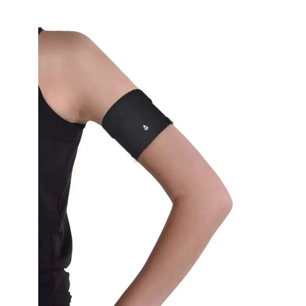 Narrow Diabetic Sensor Armband on upper arm, black, breathable fabric for secure fit.