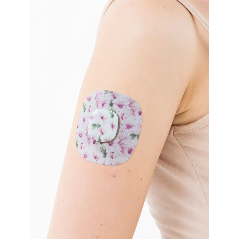 Plaster til Simplera Sync, Spring-serien, på armen med det dekorative midterstykke