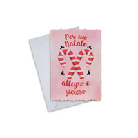 Elegant Christmas greeting card with candy cane design, featuring message in Italian, accompanied by white envelope.