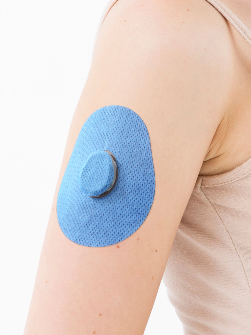 Plaster til Dexcom G7, form: dråbe, på armen, nærbillede