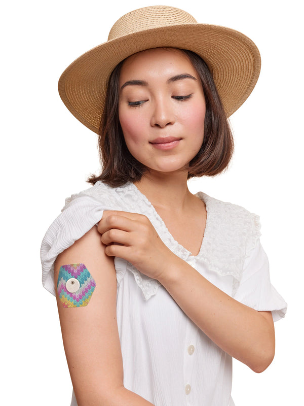FreeStyle Libre 3 hexagonal shape patch worn on a woman’s arm, with breathable adhesive fabric for sensor support