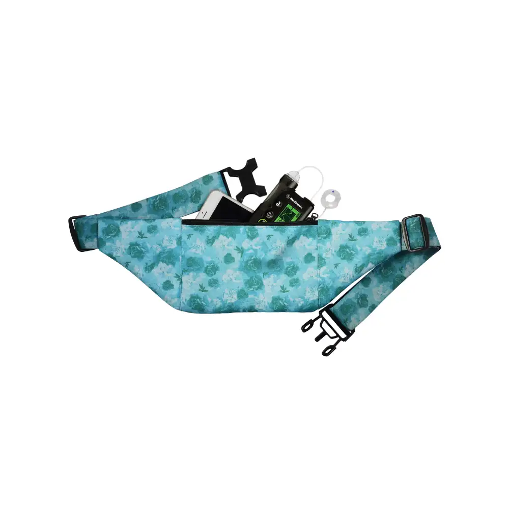 Turquoise floral insulin pump belt with two pockets for secure device storage.