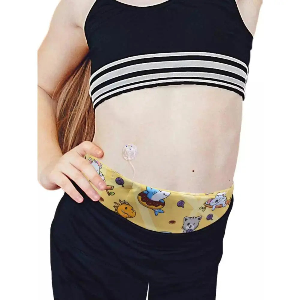 Child wearing Dia-BellyBand MINI insulin pump waist belt with colorful animal prints designed for small children.