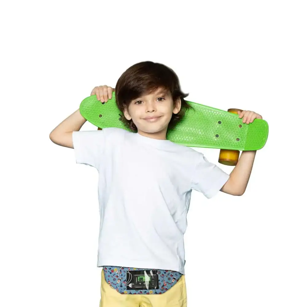 Child wearing Dia-Twin Pocket Belt for insulin pump and phone, holding a green skateboard.