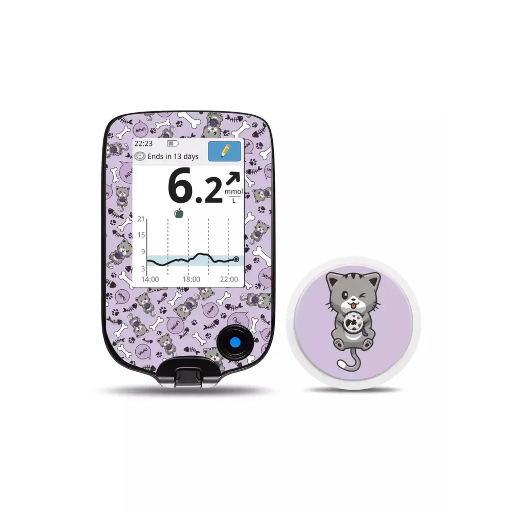 Freestyle Libre Reader and sensor with decorative cat-themed stickers, enhancing style and protection.
